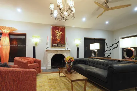 a bedroom with a bed couch and window