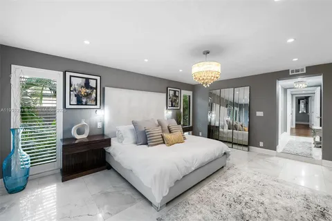 a bedroom with furniture and window