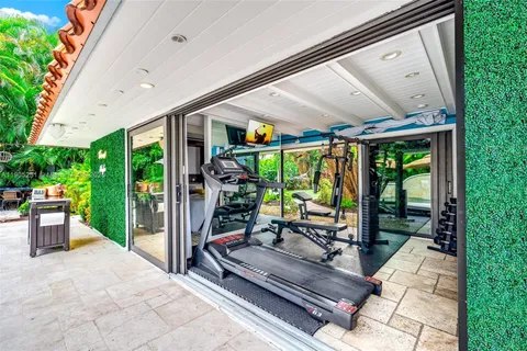 a view of a patio with a dining table and chairs