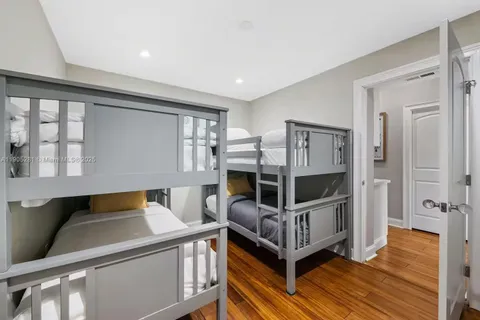 a view of a house with backyard porch and sitting area