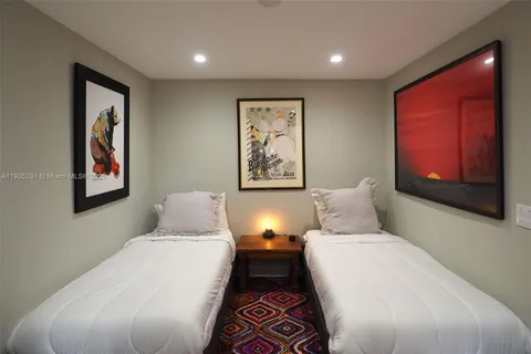 a view of a patio with couches and a table and chairs with plants