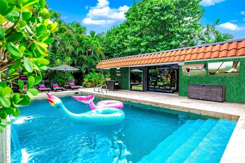 a view of swimming pool with sitting area