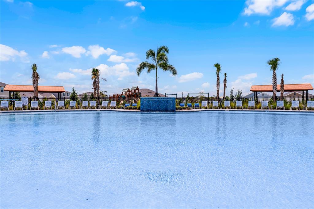 1812 Three Bars Road Kissimmee, FL 34744 - Photo 48 of 64 a view of a lake with a building in the background