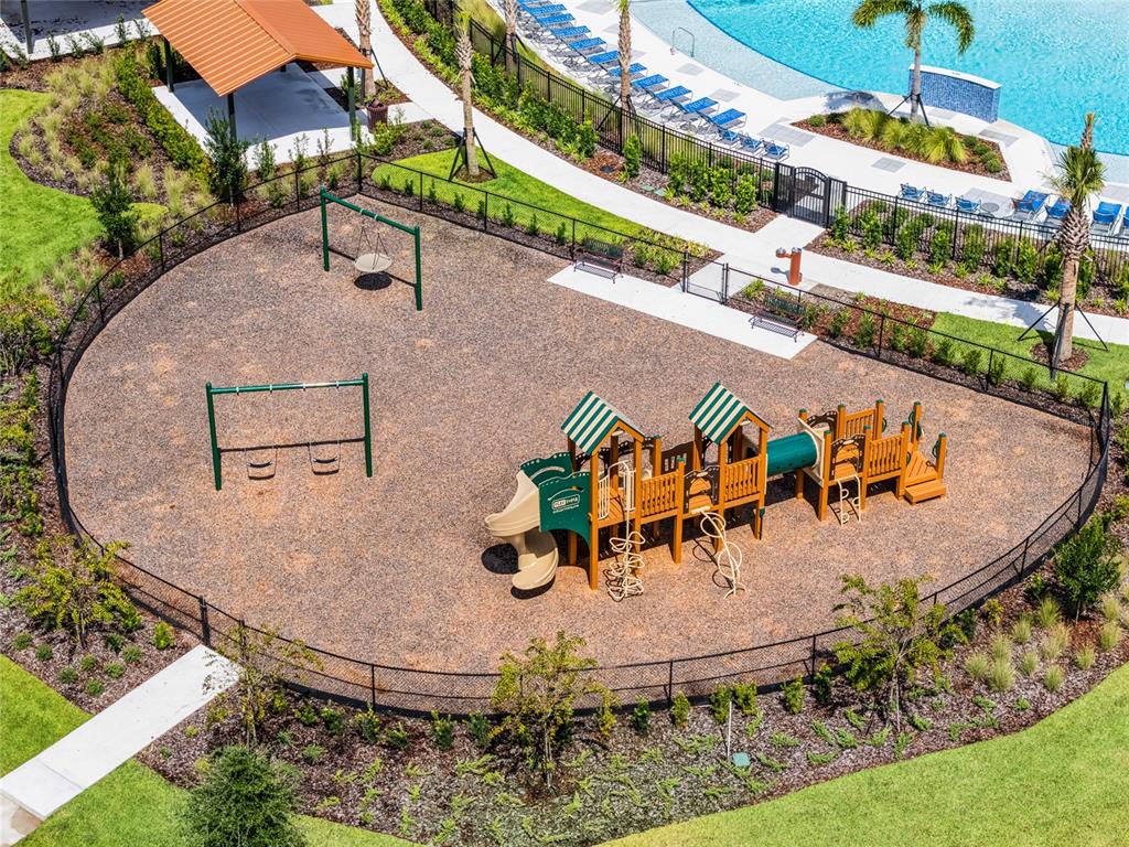 1812 Three Bars Road Kissimmee, FL 34744 - Photo 64 of 64 an aerial view of a swimming pool with outdoor seating