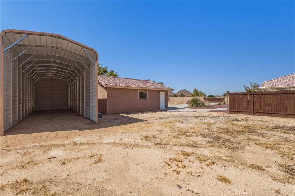 19501 Kinai Road Apple Valley, CA 92307 - Photo 48 of 49 a view of a house with a snow in the yard