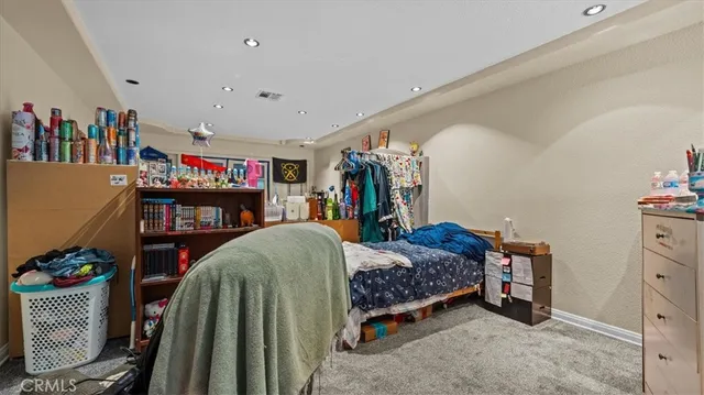 a bedroom with bed and a closet