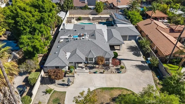an aerial view of a house with outdoor space