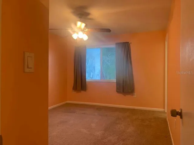 an empty room with a bathroom