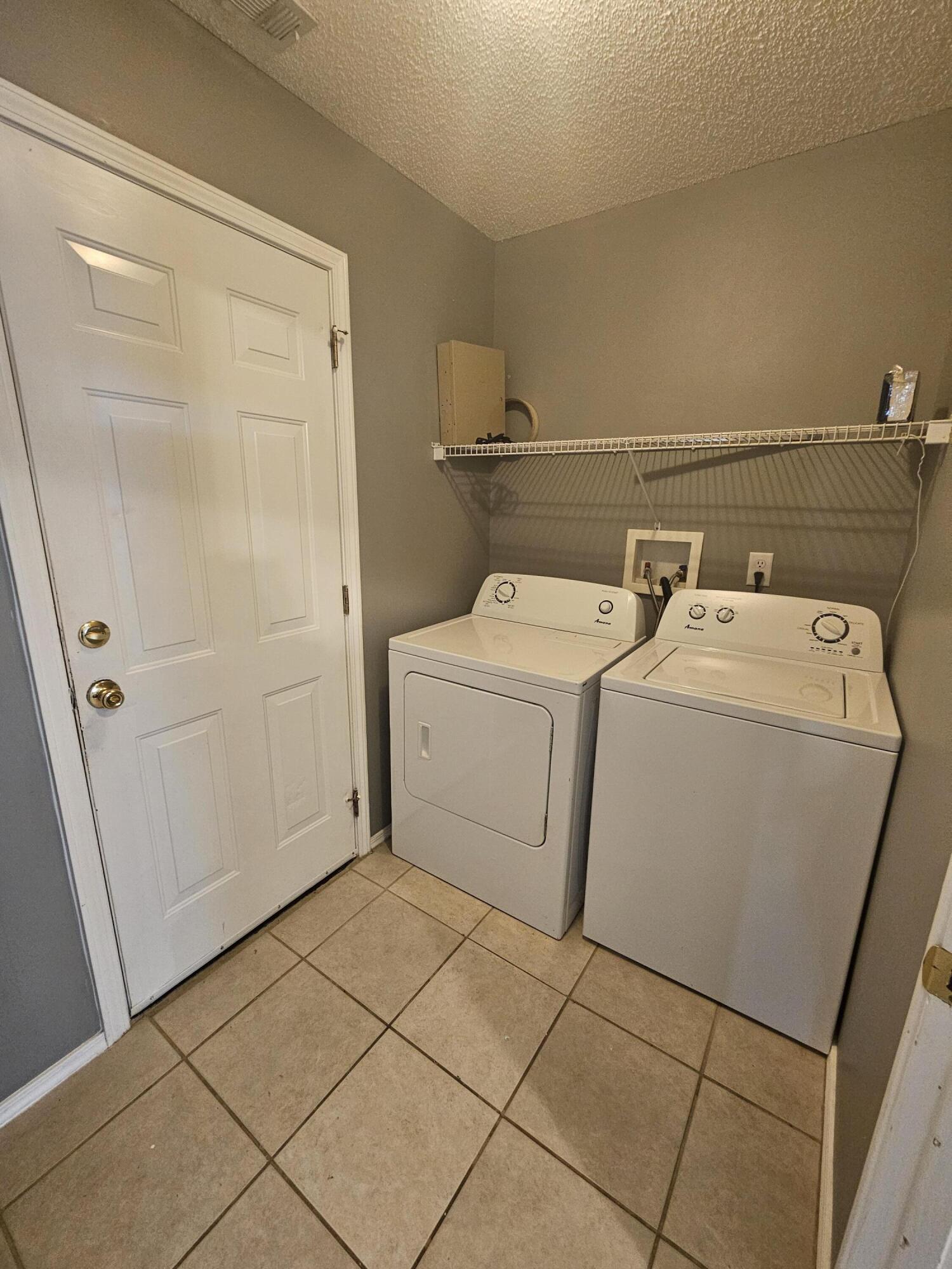 804 Travis Court Crestview, FL 32536 - Photo 14 of 33 a utility room with dryer and washer