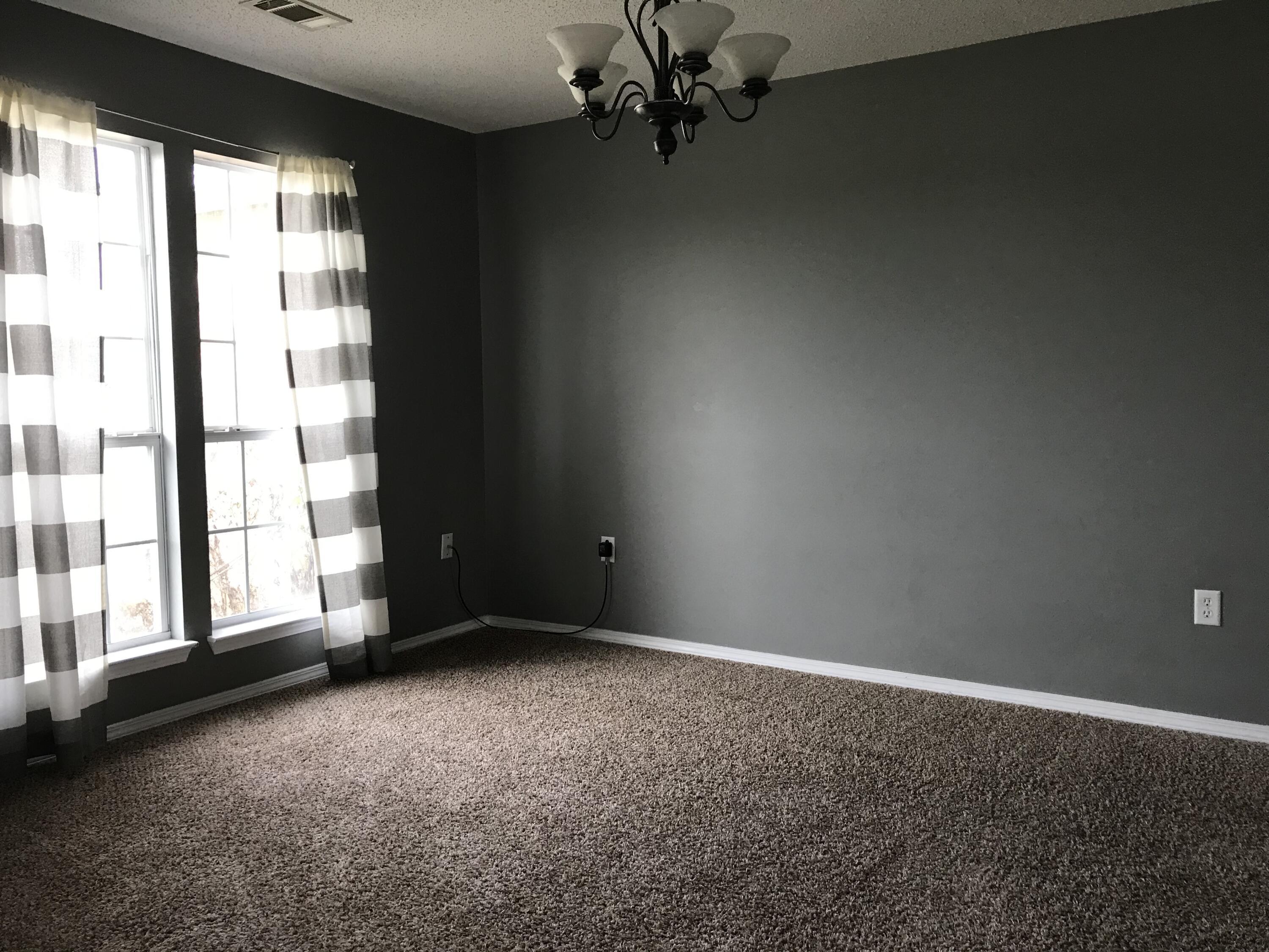 804 Travis Court Crestview, FL 32536 - Photo 16 of 33 en empty room with windows