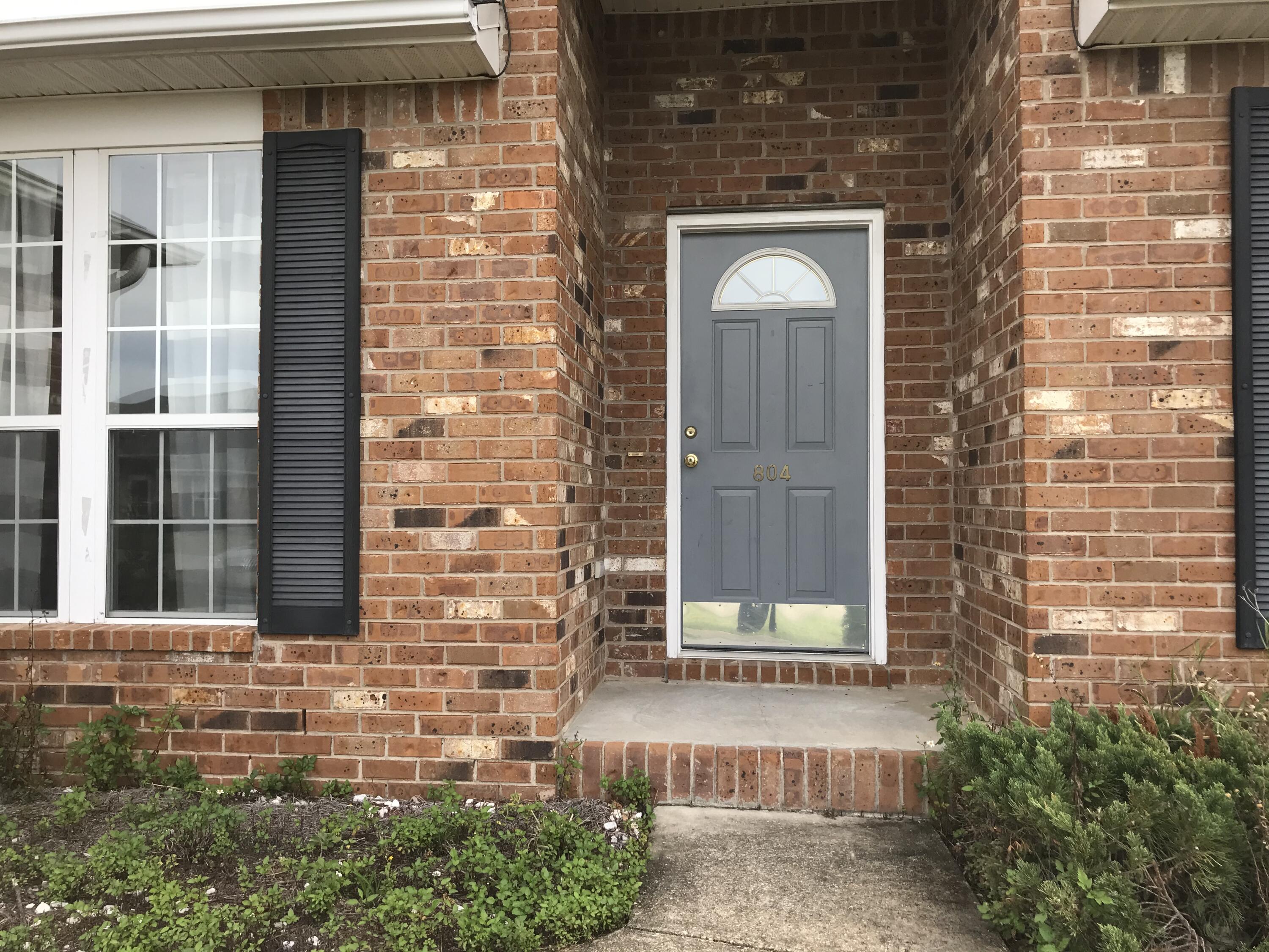 804 Travis Court Crestview, FL 32536 - Photo 2 of 33 a front view of a house with a glass door