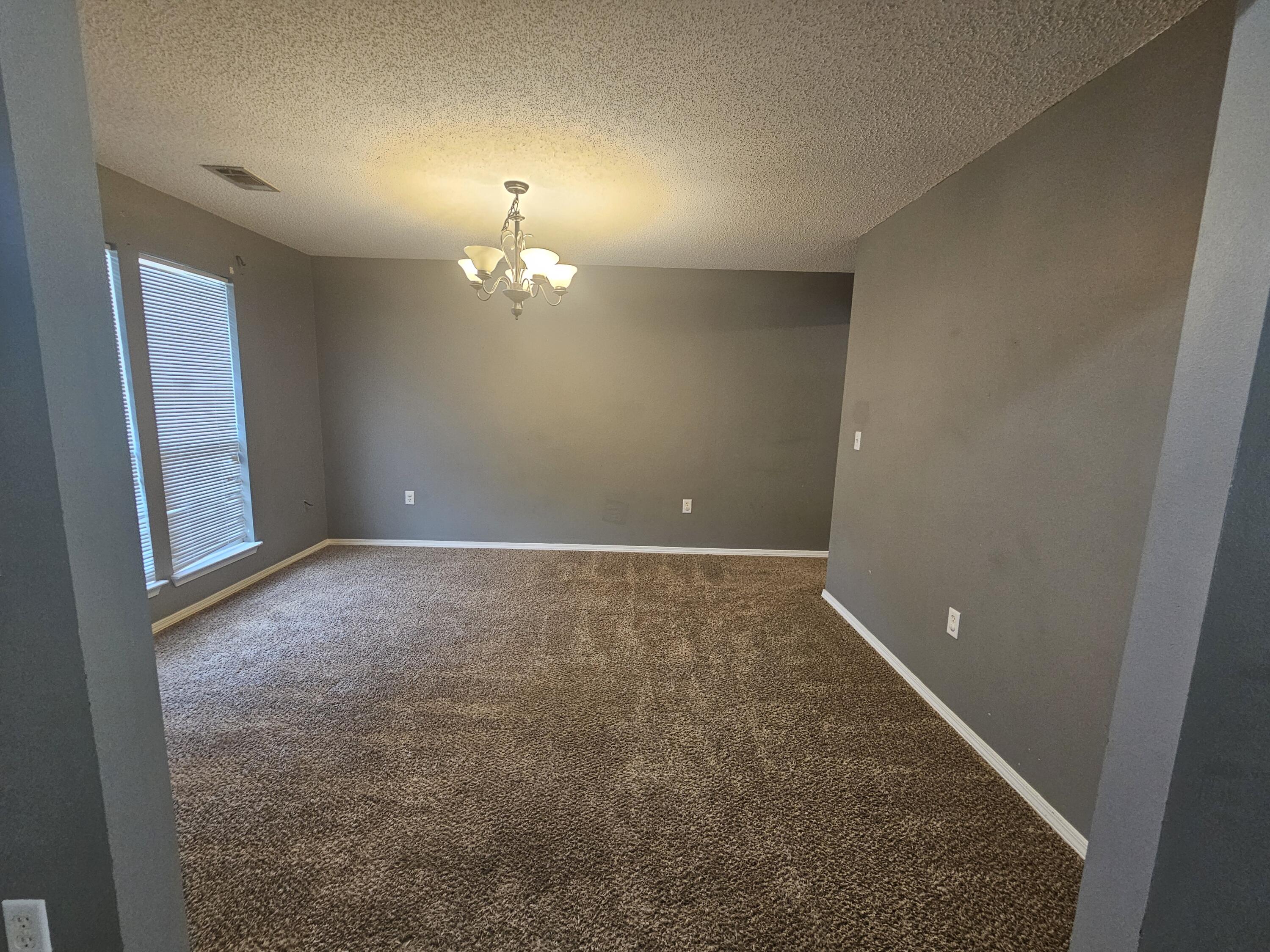 804 Travis Court Crestview, FL 32536 - Photo 29 of 33 a view of a room with a ceiling fan and window