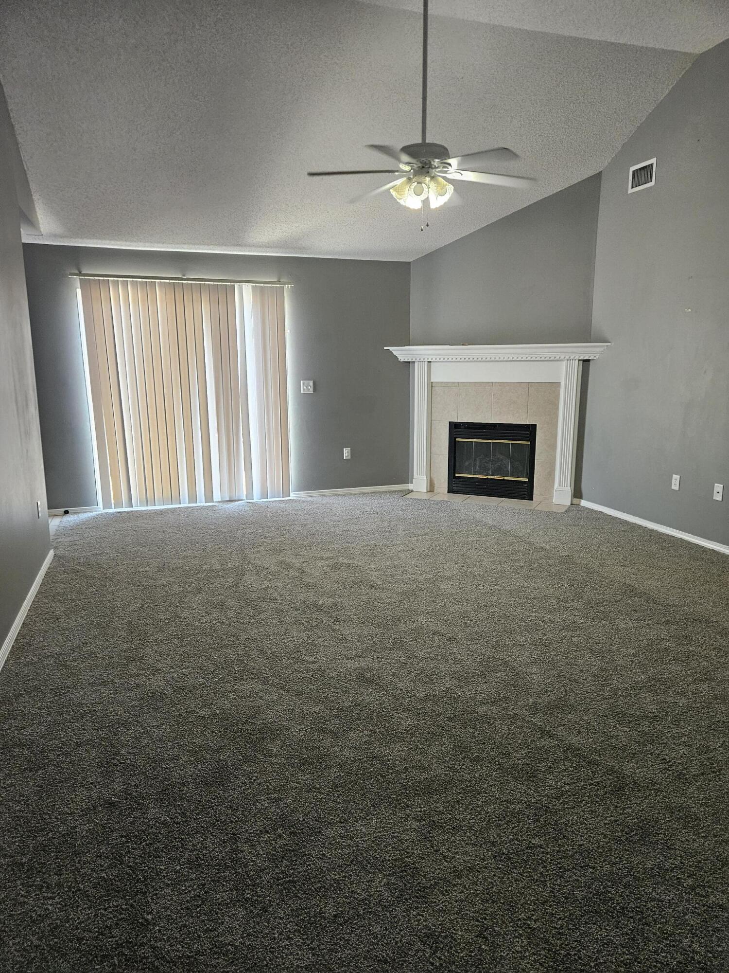 804 Travis Court Crestview, FL 32536 - Photo 4 of 33 a view of an empty room with window and chandelier fan