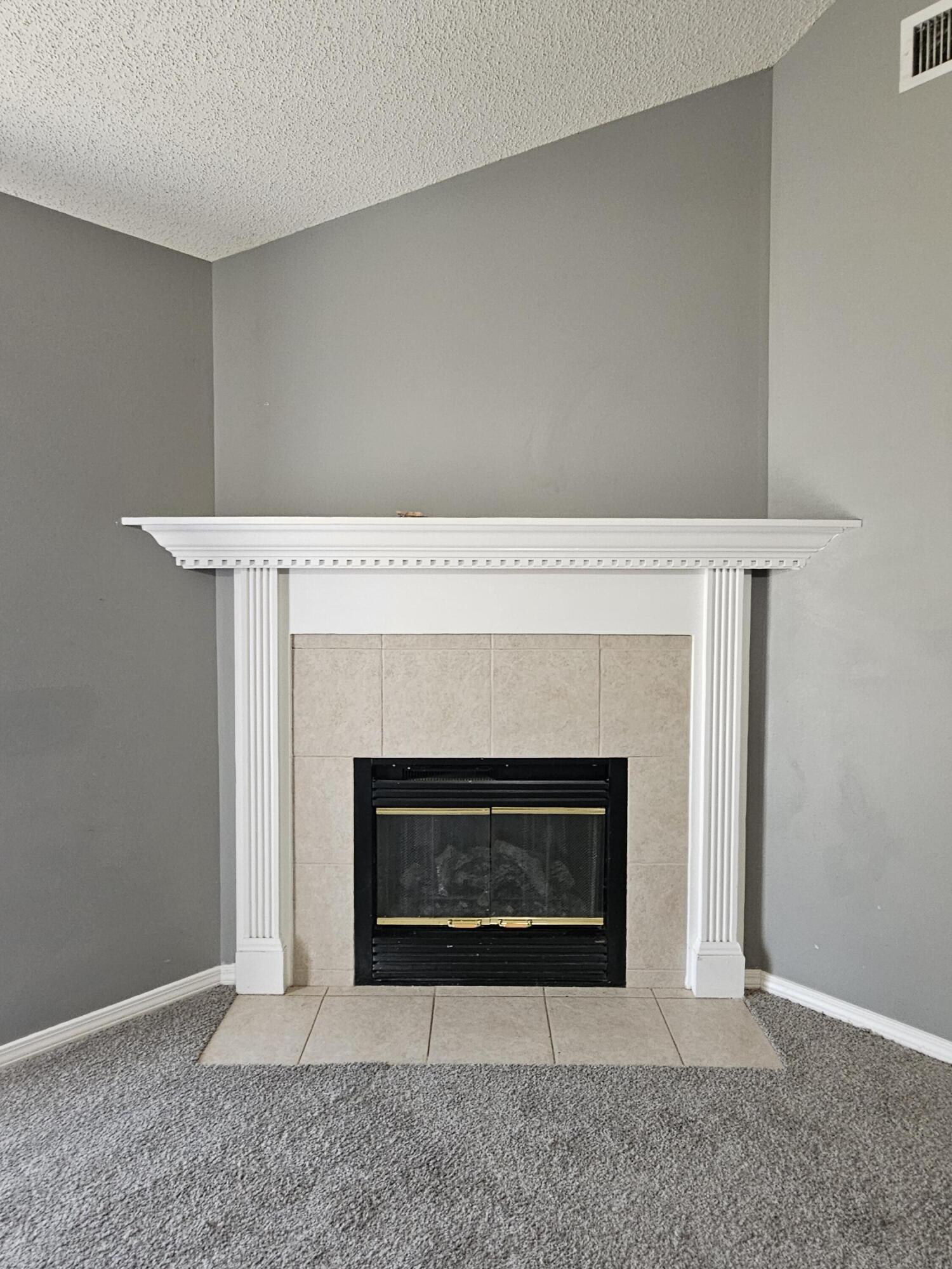 804 Travis Court Crestview, FL 32536 - Photo 7 of 33 a living room with a fireplace