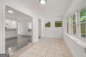 260 Patterson Avenue Southeast, Unit A Atlanta, GA 30316 - Photo 14 of 16 a view of an empty room with glass door and windows