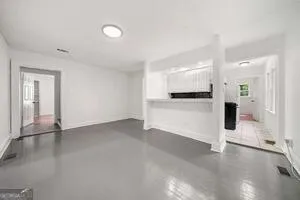 a kitchen with a stove and a refrigerator