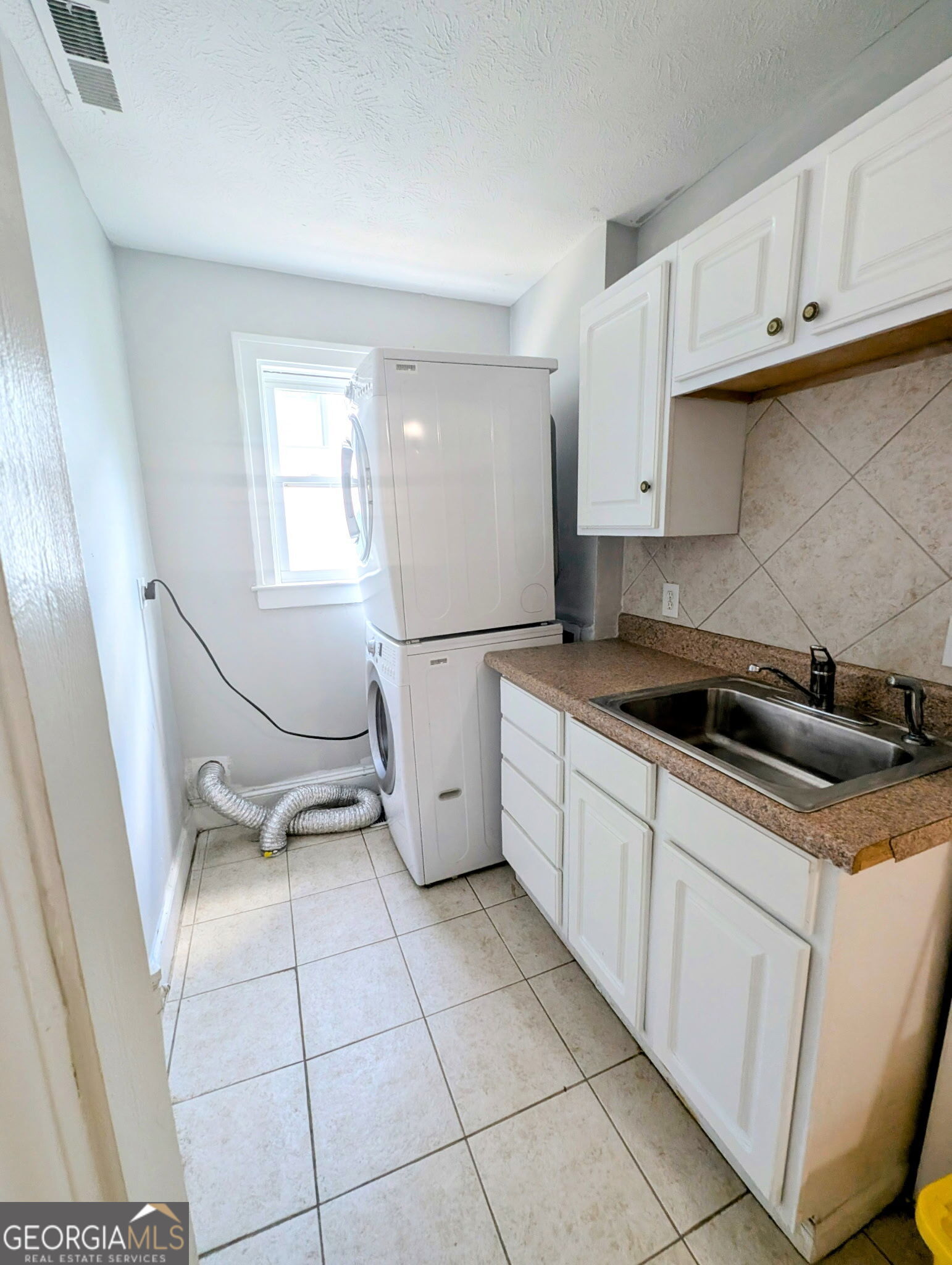 260 Patterson Avenue Southeast, Unit A Atlanta, GA 30316 - Photo 4 of 16 a kitchen with a sink a stove and cabinets
