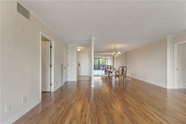 a view of dining room with furniture and wooden floor