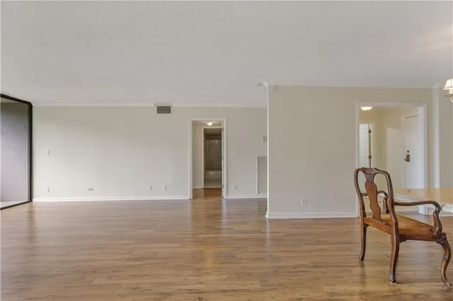 a view of a livingroom with furniture and wooden floor