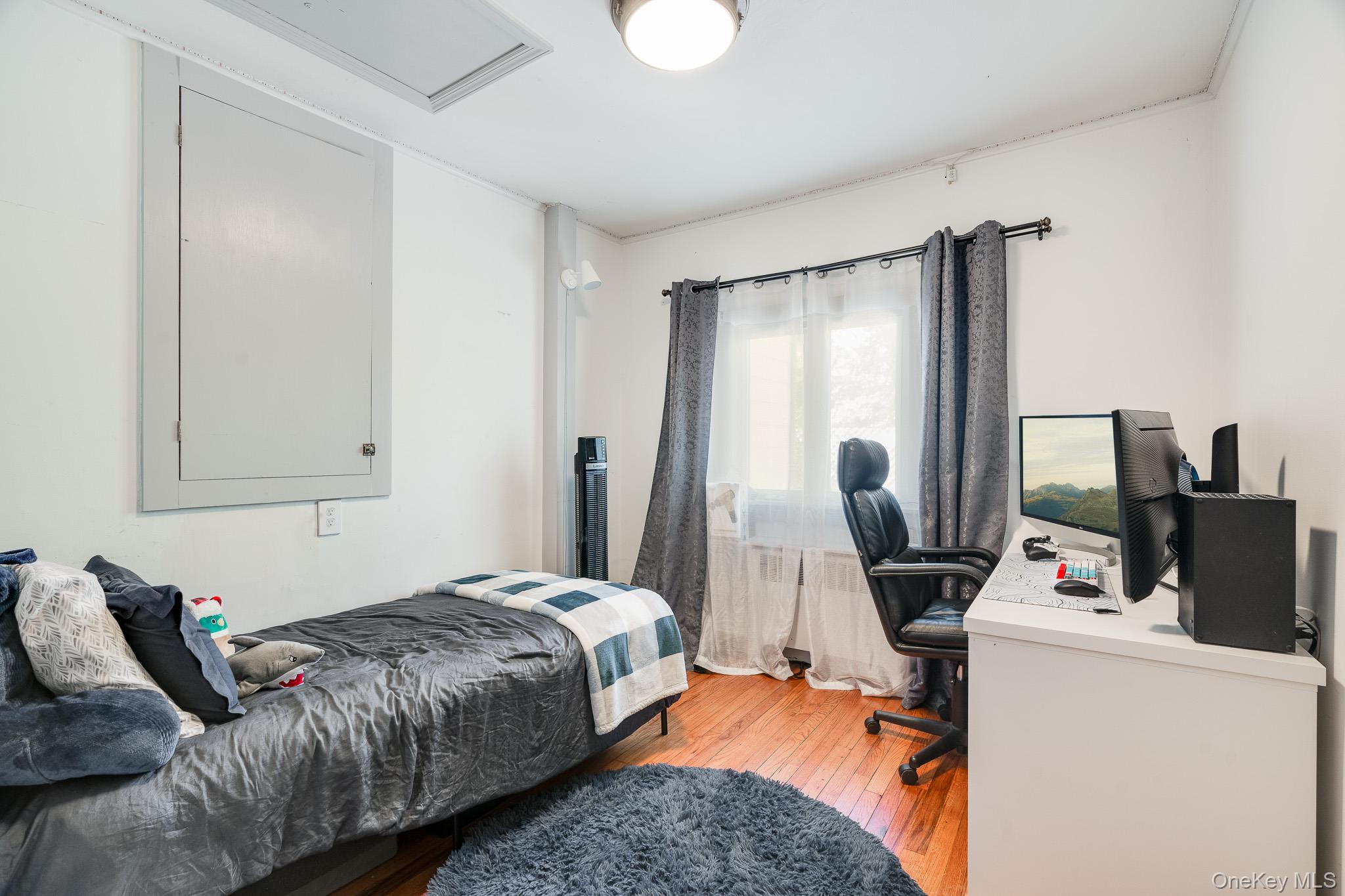 553 Hosner Mountain Road Stormville, NY 12582 - Photo 11 of 36 a bedroom with a bed and a flat screen tv