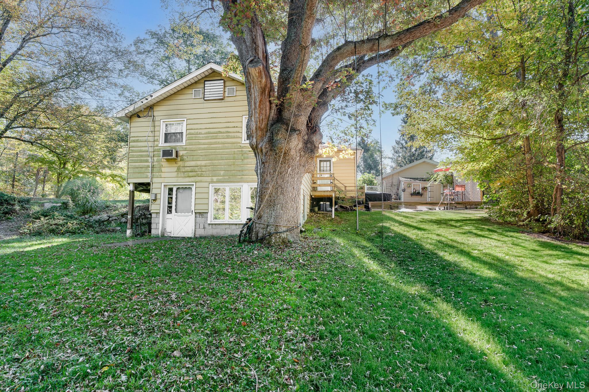 553 Hosner Mountain Road Stormville, NY 12582 - Photo 20 of 36 a view of a house with backyard and a tree