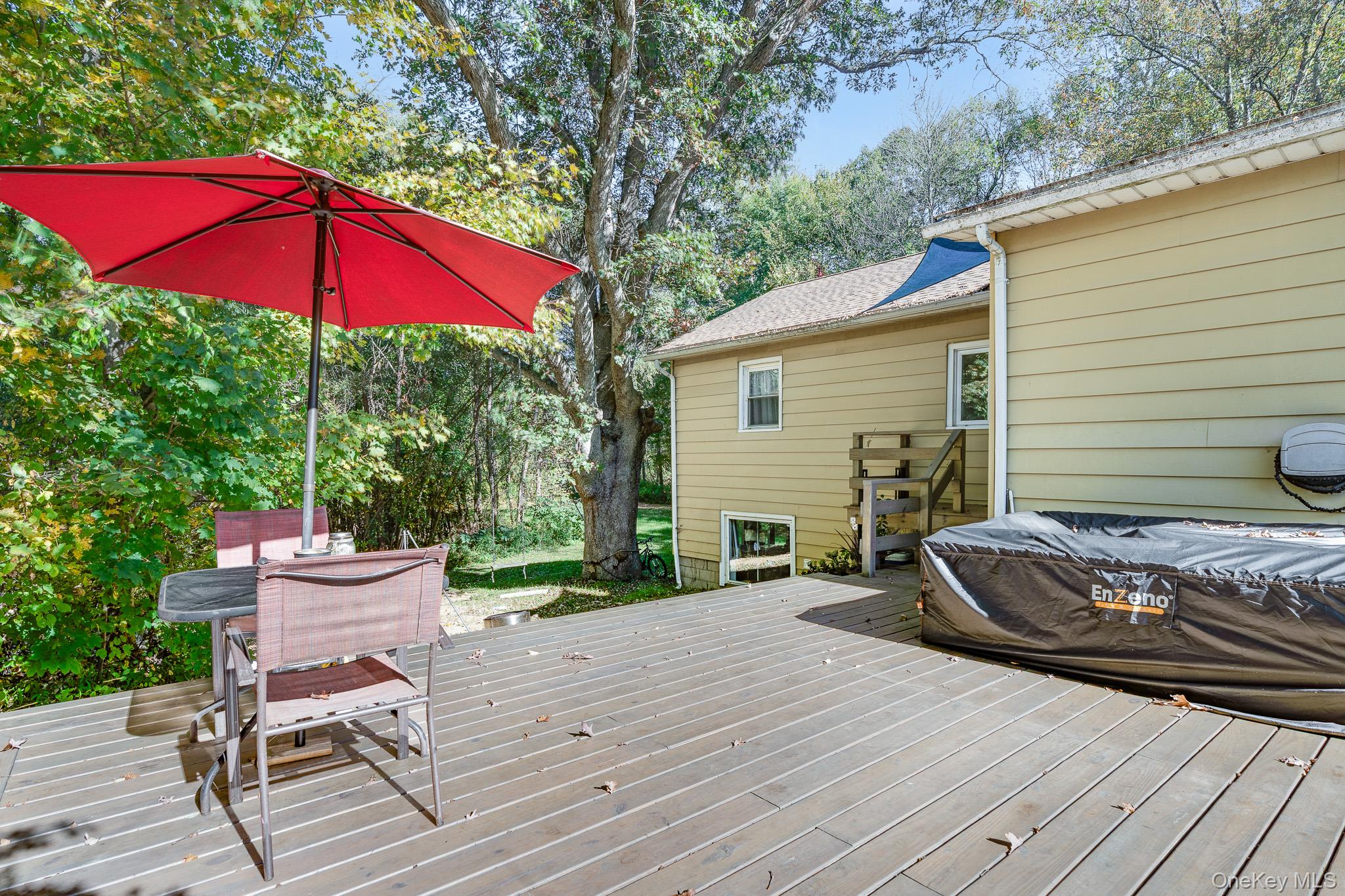 553 Hosner Mountain Road Stormville, NY 12582 - Photo 21 of 36 a view of a deck with furniture and a yard