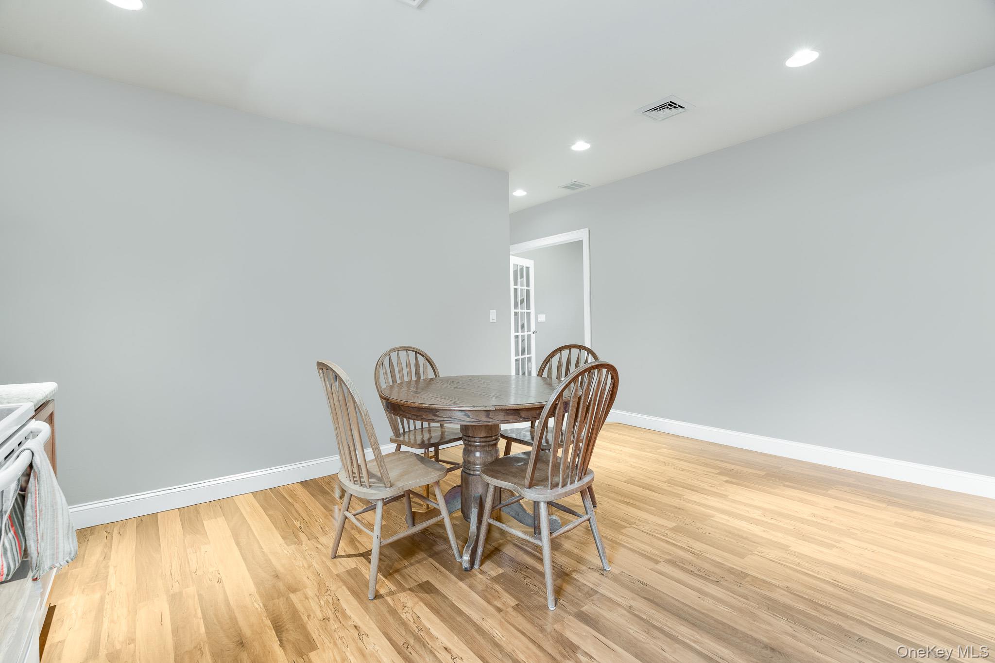 553 Hosner Mountain Road Stormville, NY 12582 - Photo 33 of 36 a view of a dining room with furniture and wooden floor