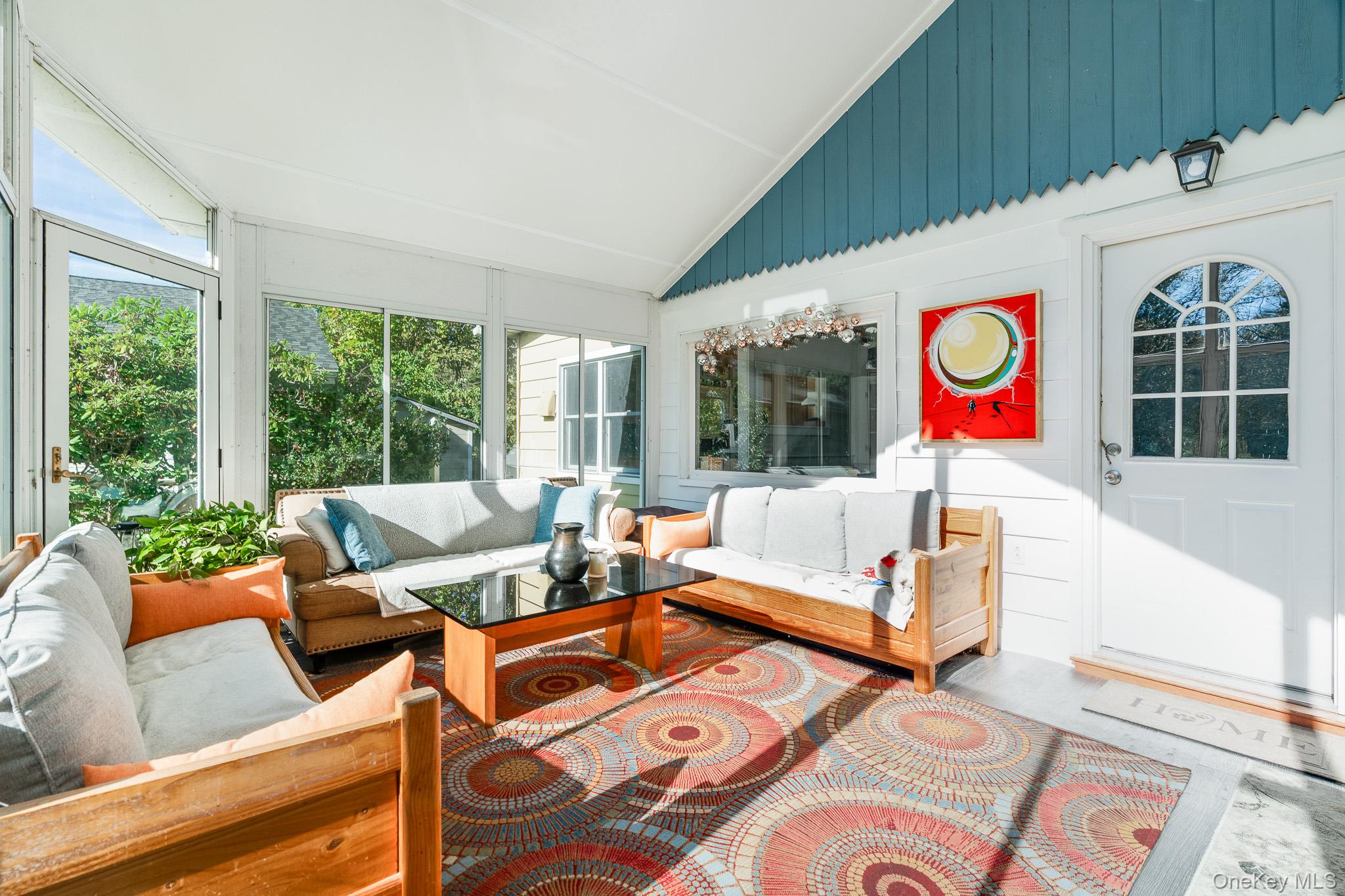 553 Hosner Mountain Road Stormville, NY 12582 - Photo 5 of 36 a living room with patio furniture and a large window