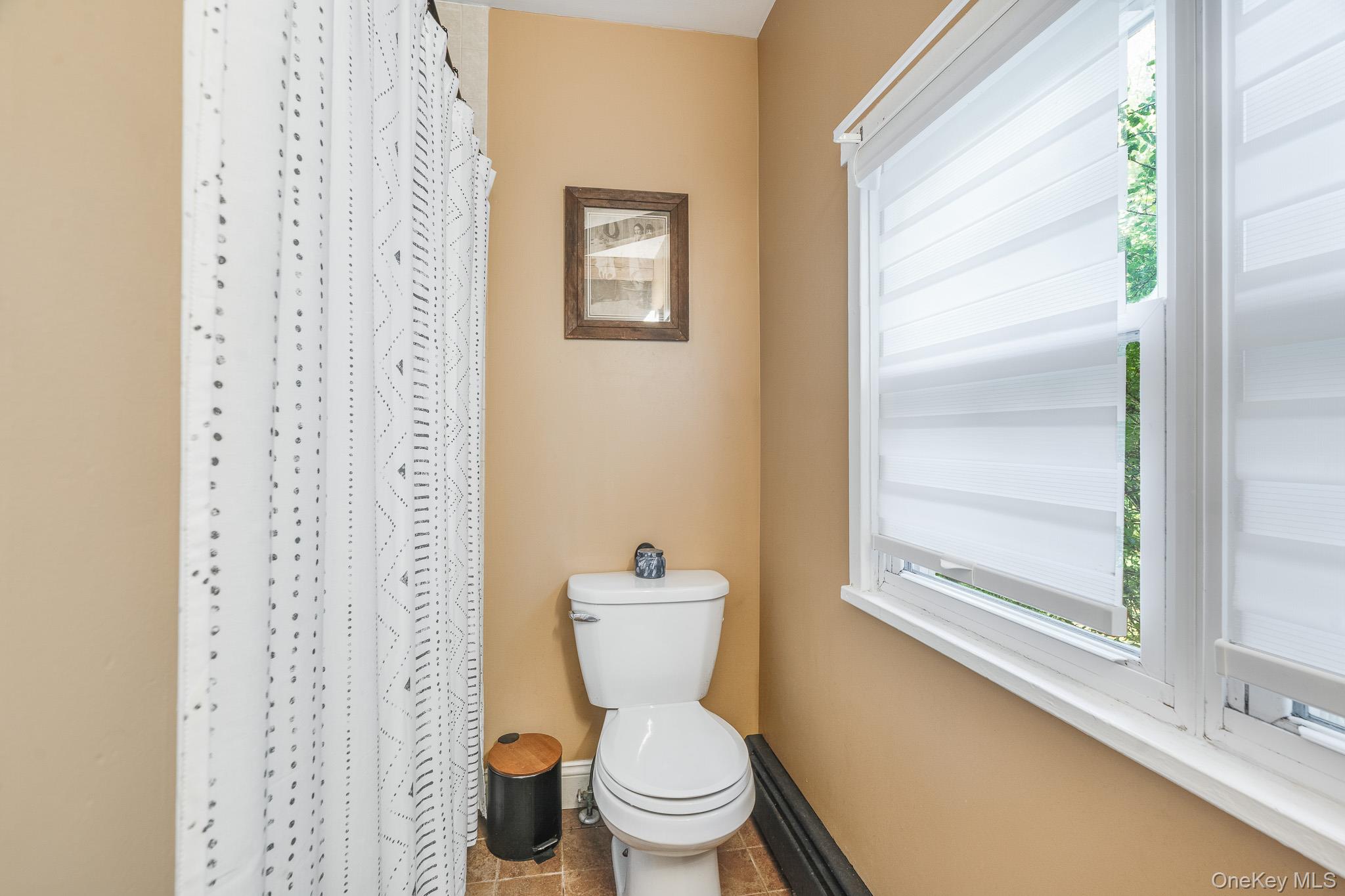 553 Hosner Mountain Road Stormville, NY 12582 - Photo 9 of 36 a white toilet sitting next to a bathroom sink