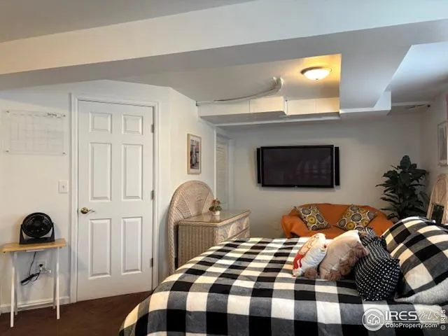 a bedroom with a bed and a chair