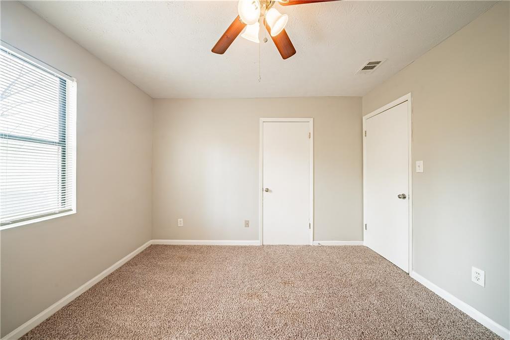 5175 Walker Road Stone Mountain, GA 30088 - Photo 20 of 37 a view of an empty room with a window