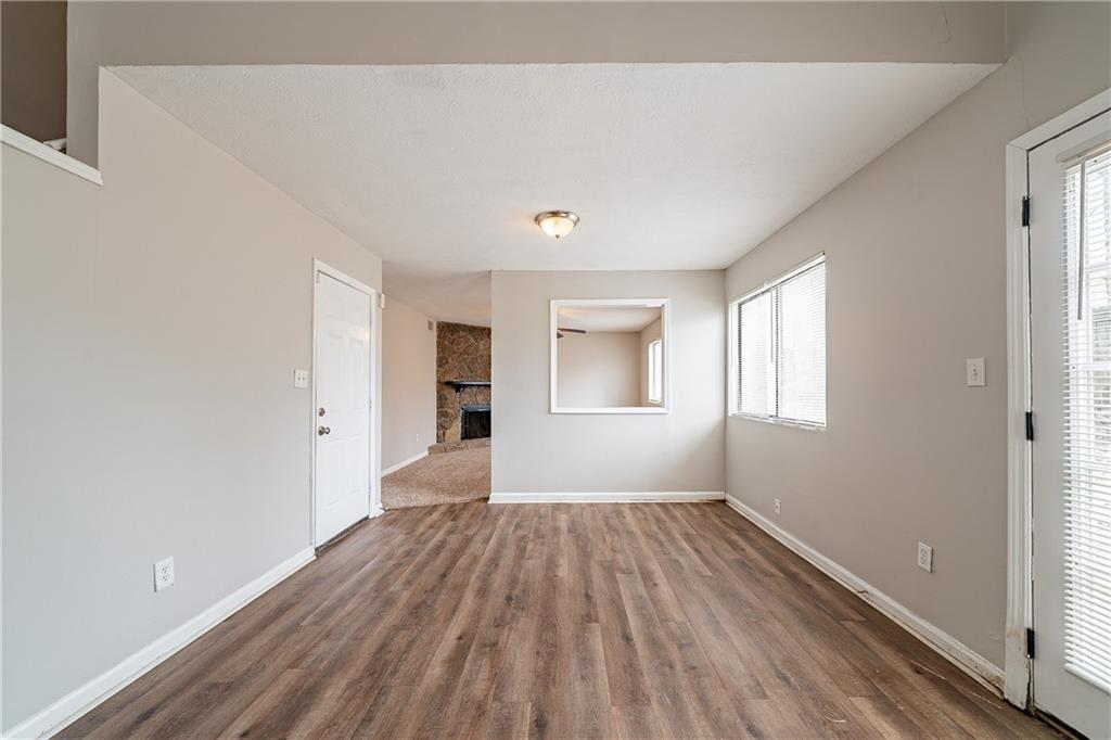 5175 Walker Road Stone Mountain, GA 30088 - Photo 25 of 37 a view of a room with wooden floor and windows