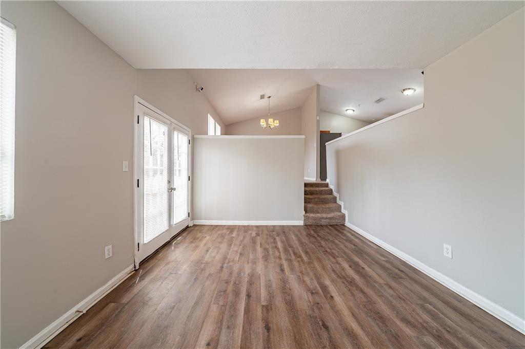 5175 Walker Road Stone Mountain, GA 30088 - Photo 26 of 37 wooden floor in an empty room with a window