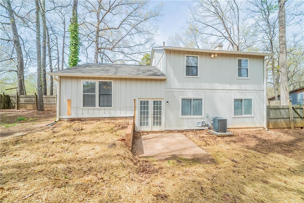 5175 Walker Road Stone Mountain, GA 30088 - Photo 33 of 37 a front view of a house with a yard covered in snow