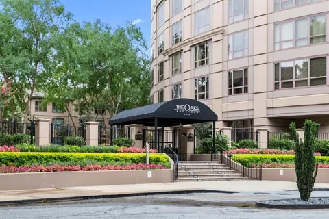 a front view of a building with garden