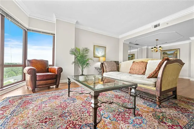 a living room with furniture and a rug