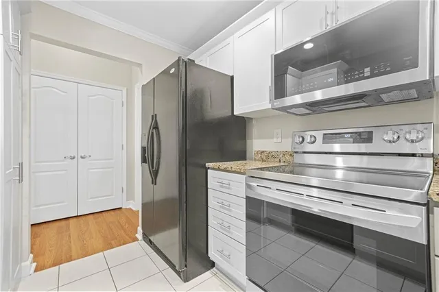 a kitchen with a stove and a refrigerator