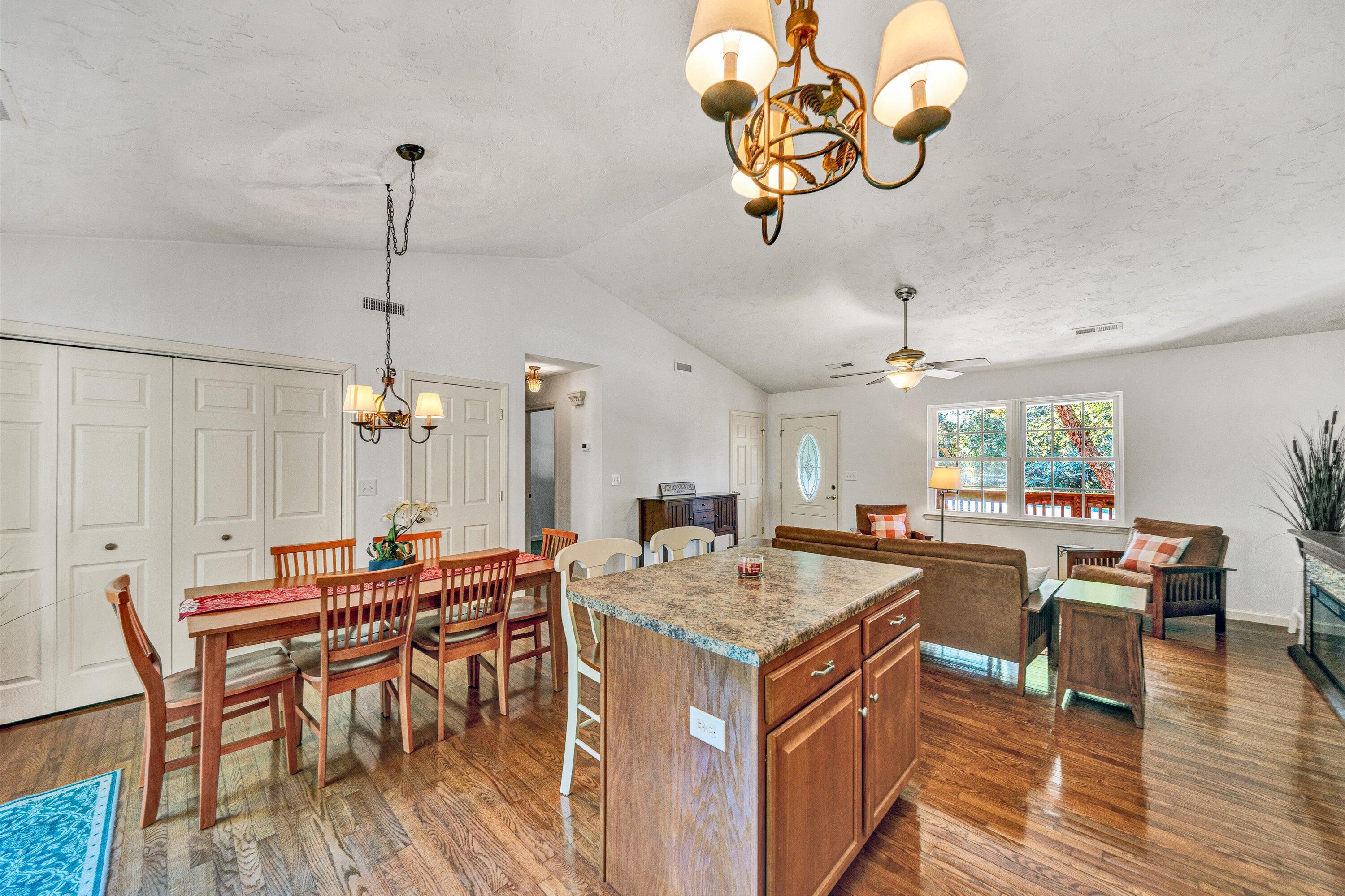 801 Indian Ridge Drive Moneta, VA 24121 - Photo 15 of 36 an open kitchen with a table and chairs