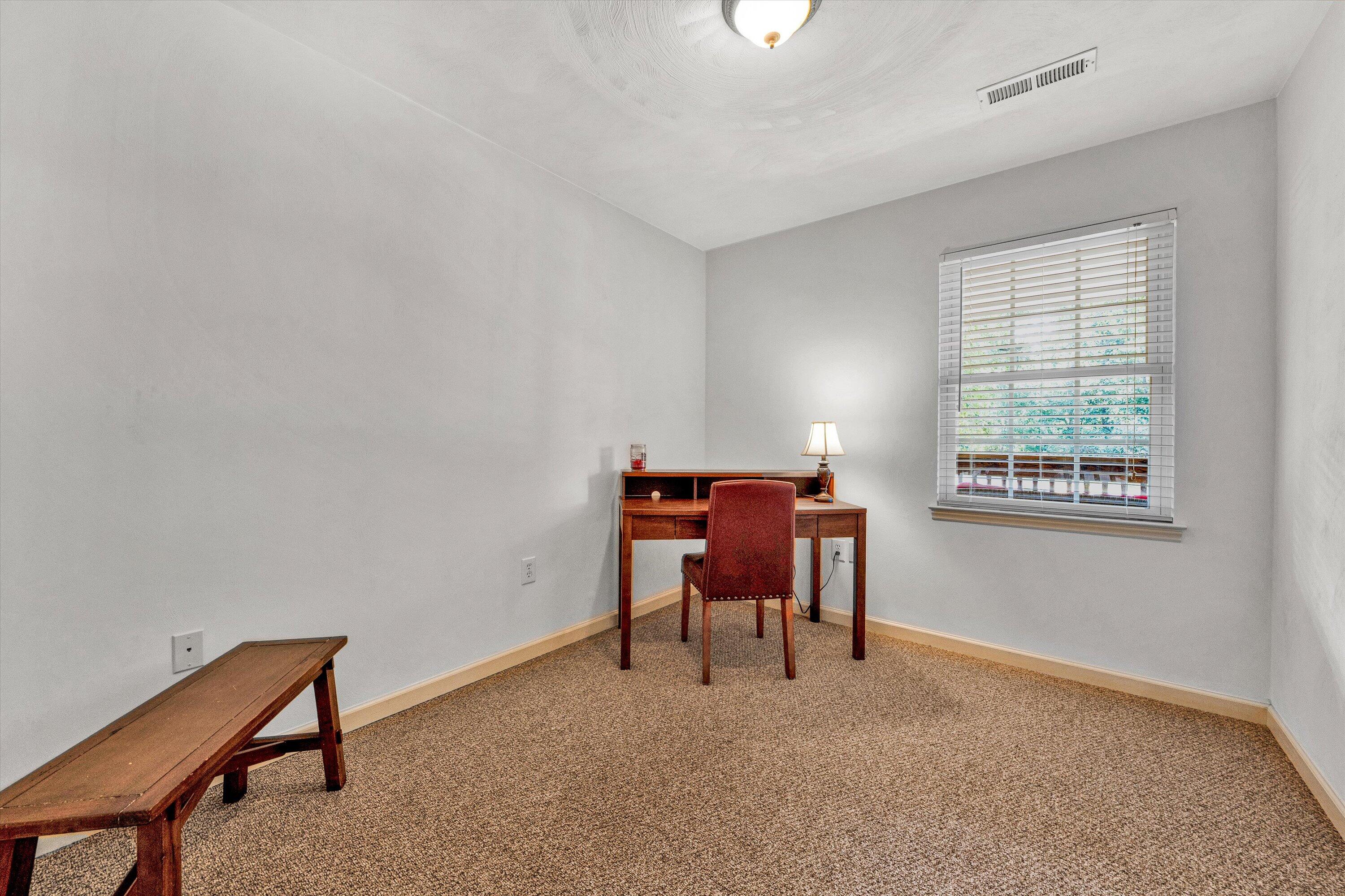 801 Indian Ridge Drive Moneta, VA 24121 - Photo 24 of 36 a workspace with furniture and a window