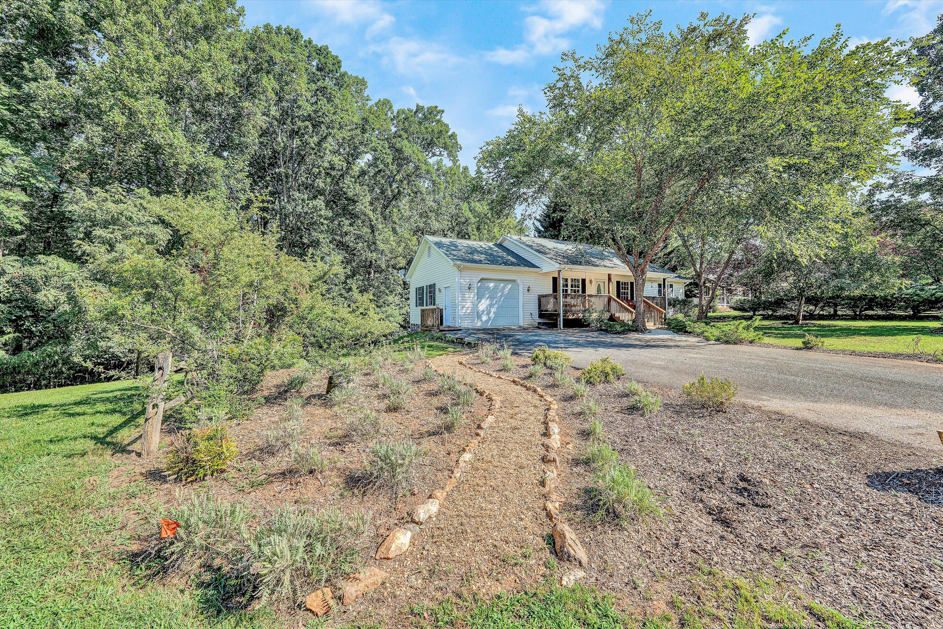 801 Indian Ridge Drive Moneta, VA 24121 - Photo 3 of 36 a house view with a outdoor space