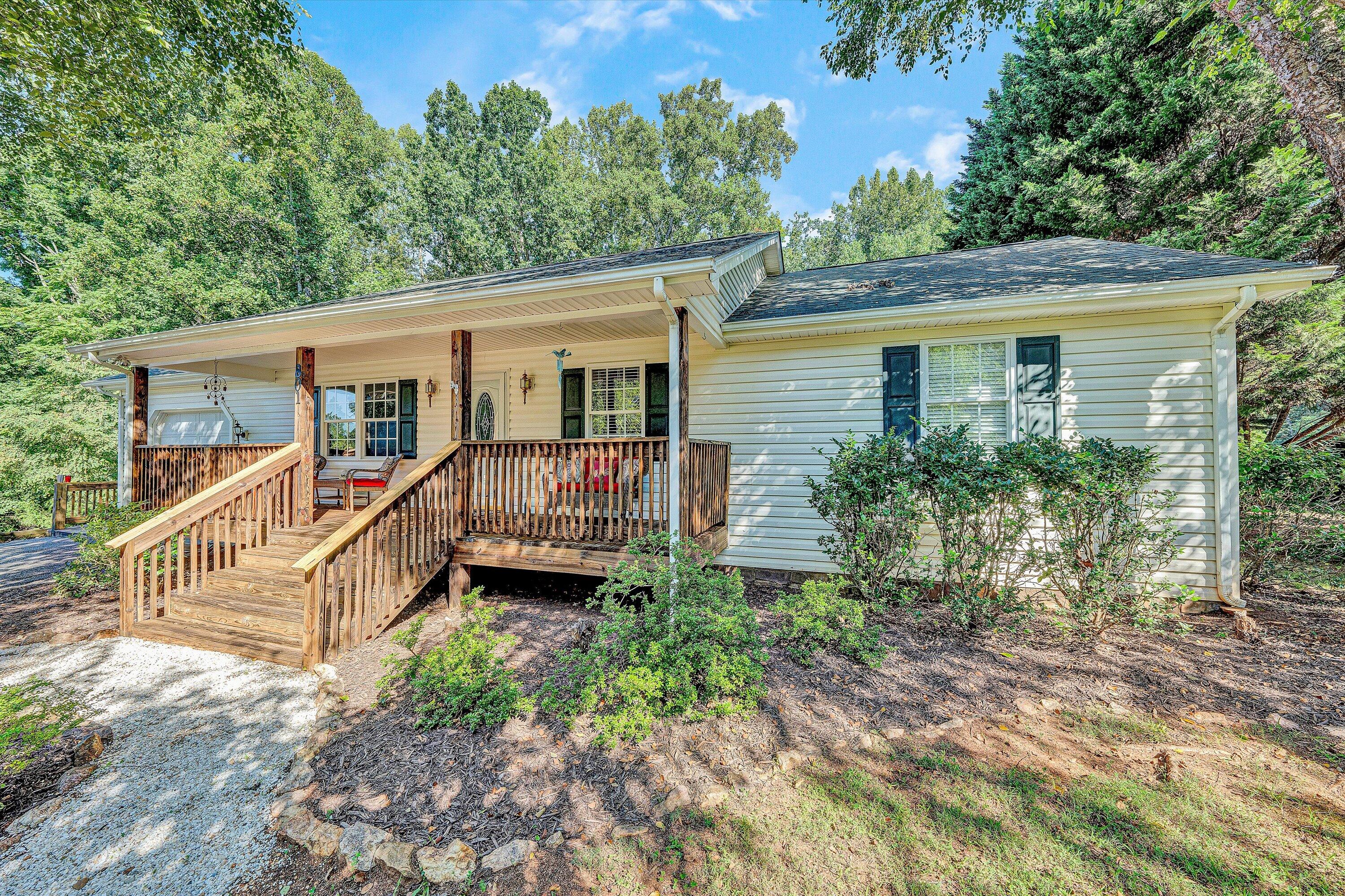 801 Indian Ridge Drive Moneta, VA 24121 - Photo 5 of 36 a view of a house with a yard and deck area