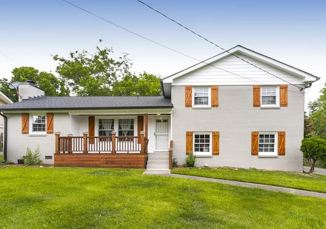 front view of a house with a yard