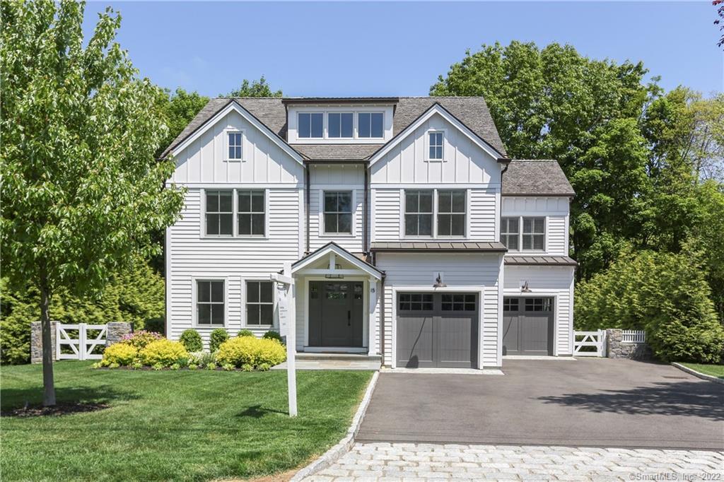 15 Walmsley Road Darien, CT 06820 - Photo 1 of 1 a front view of a house with garden
