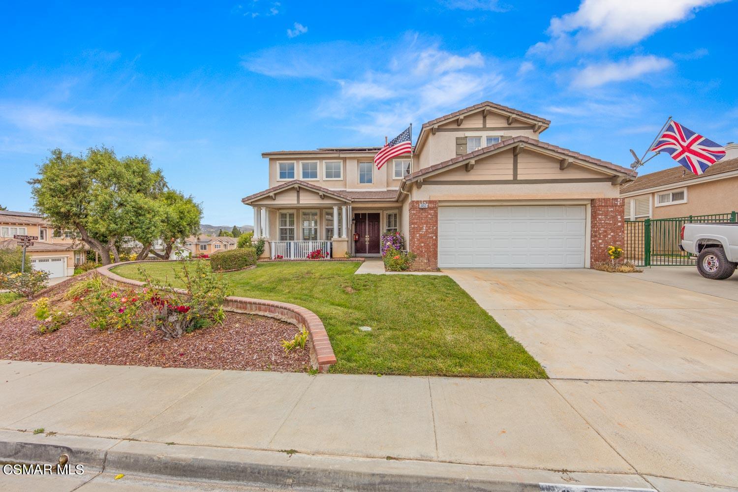 3453 Almond Tree Court Simi Valley, CA 93065 - Photo 1 of 20 a front view of a house with a garden and plants