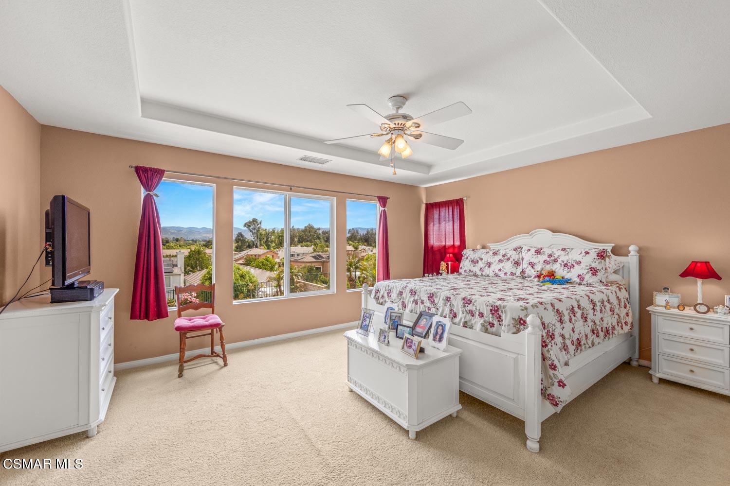 3453 Almond Tree Court Simi Valley, CA 93065 - Photo 11 of 20 a bedroom with a bed couch and a large window