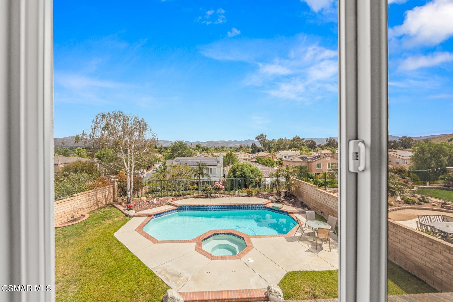 3453 Almond Tree Court Simi Valley, CA 93065 - Photo 12 of 20 a view of a swimming pool with a chairs