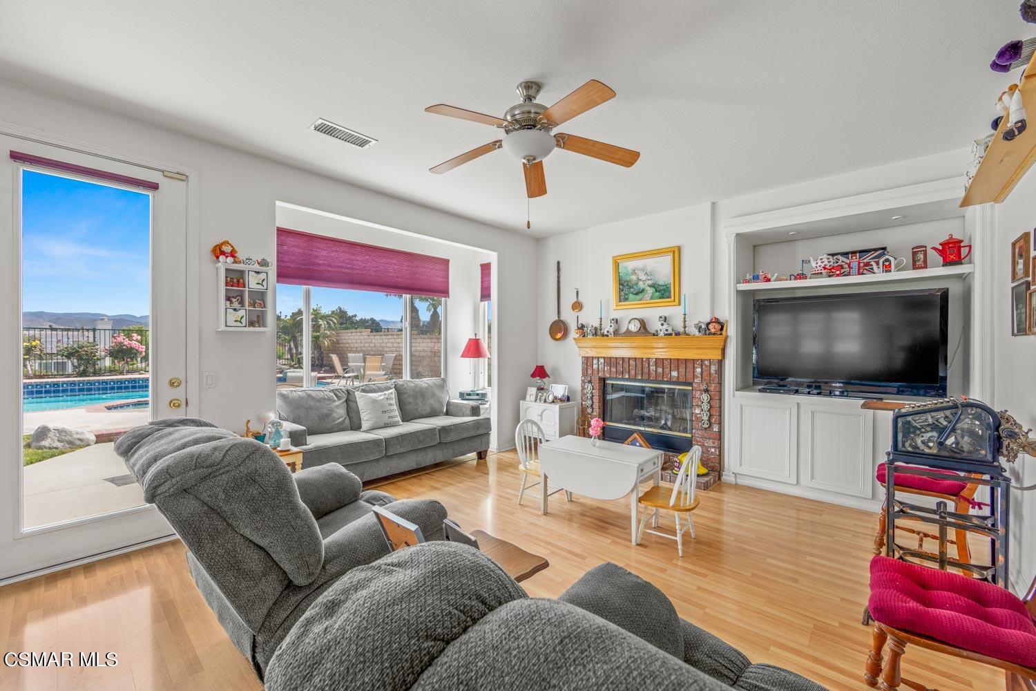 3453 Almond Tree Court Simi Valley, CA 93065 - Photo 6 of 20 a living room with furniture and a flat screen tv