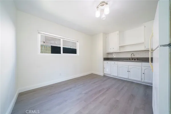 a view of a kitchen with electric appliances