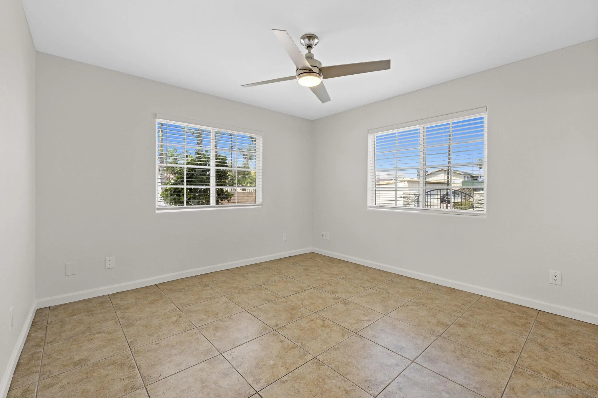 1749-51 Dahlia Avenue San Diego, CA 92154 - Photo 15 of 23 an empty room with windows and closet