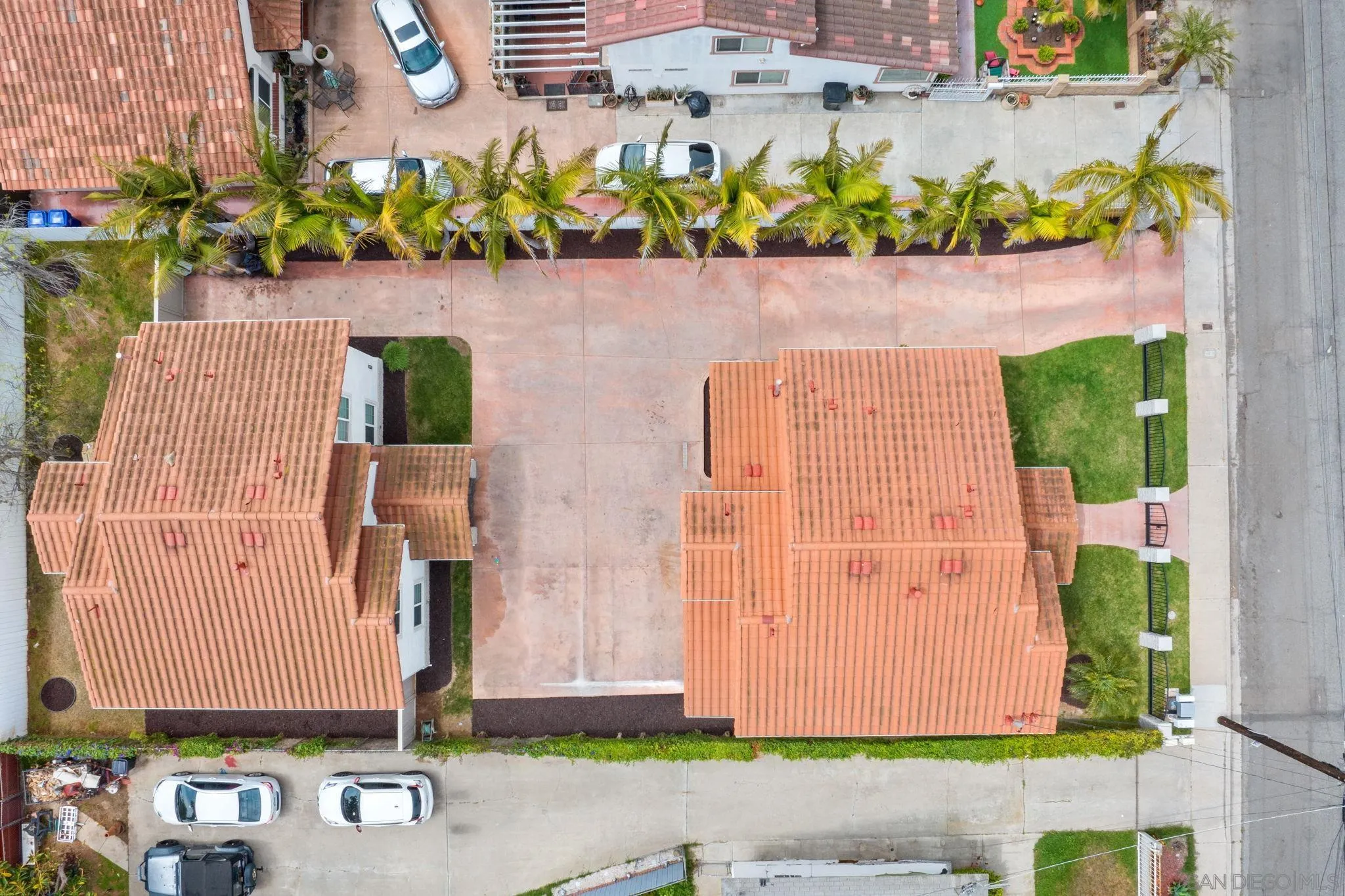 1749-51 Dahlia Avenue San Diego, CA 92154 - Photo 19 of 23 a front view of a house with a garden
